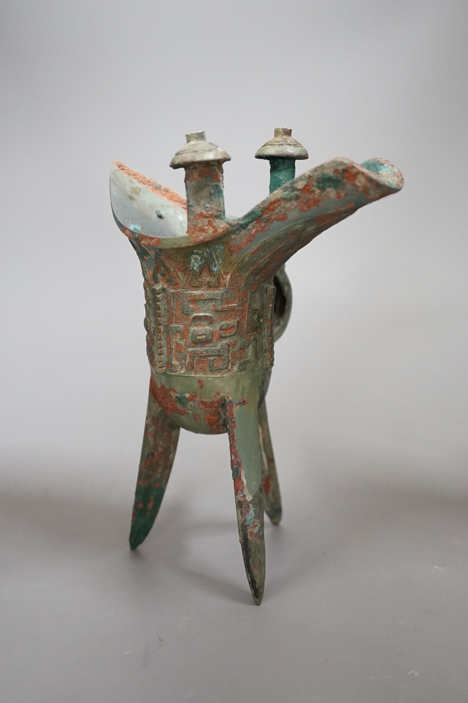A Chinese archaistic bronze vessel, jue, 21cm high